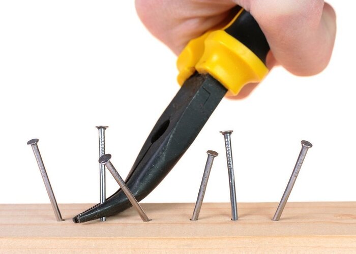 remove nails from wood using pliers