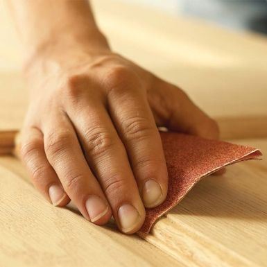 Sand the wood surface before applying beeswax