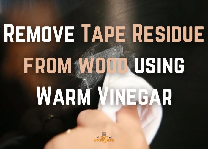 Get rid of tape spots from wood using warm vinegar