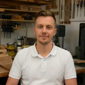 Adrian Tapu, founder of Start Woodworking Now, in his workshop